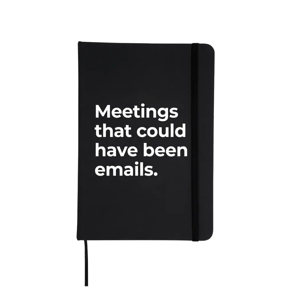 Agendă neagră cu mesaj „Meetings that could have been emails”