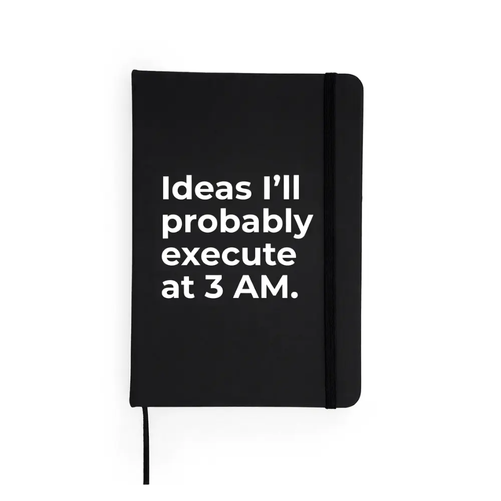 Agendă neagră cu mesaj „Ideas I’ll probably execute at 3 AM.”